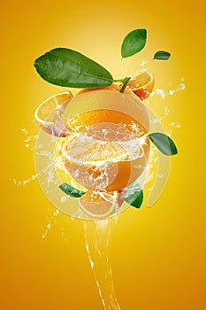 Water splashing on Fresh Sliced Ã¢â¬â¹Ã¢â¬â¹oranges and Orange fruit on Orange background